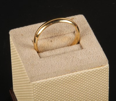 Lot 169 - An 18 carat yellow gold wedding band, 5g