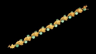 Lot 4 - An 18 carat yellow gold and green polished...