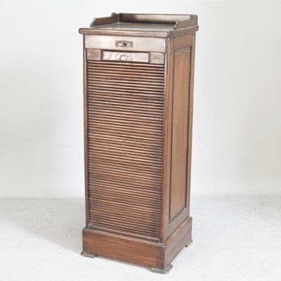 Lot 31 - A 1920s tambour front filing cabinet, with a...