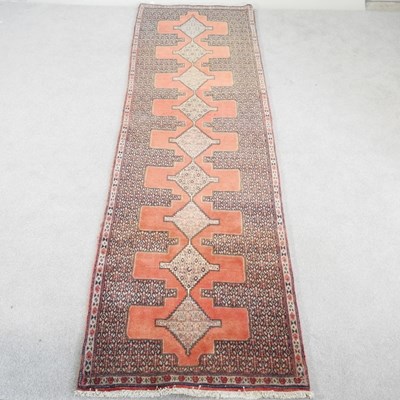 Lot 107 - A Persian senneh runner, with a row of central...