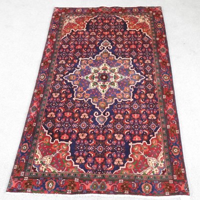 Lot 484 - A Persian sarouk rug, with a central medallion...