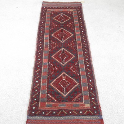 Lot 158 - A meshwani runner, with a row of four central...