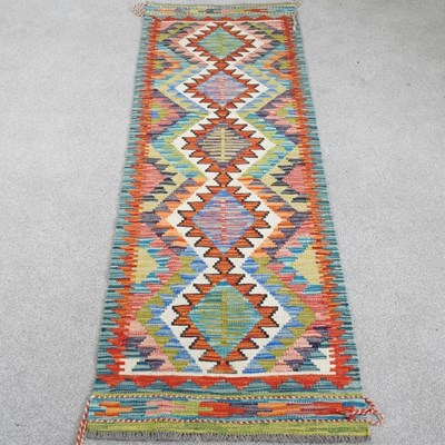 Lot 72 - A chobi kilim runner, with a central row of...