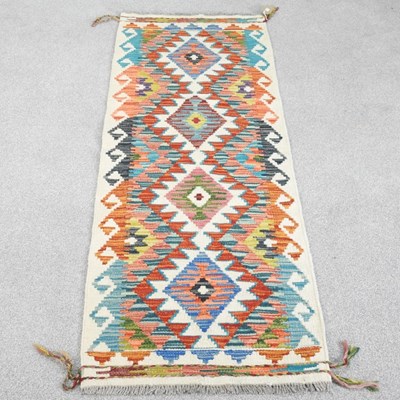 Lot 445 - A chobi kilim runner, with all over coloured...