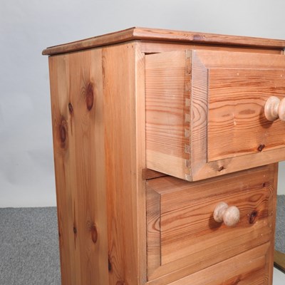 Lot 396 - A modern pine narrow chest of drawers