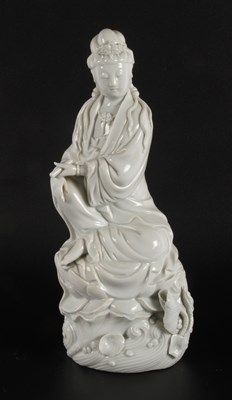 Lot 54 - A Chinese blanc-de-chine porcelain figure of...