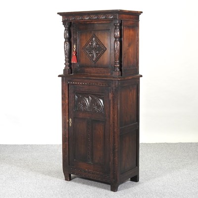 Lot 659 - A carved oak court cupboard