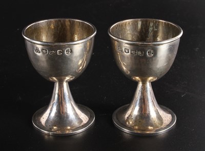 Lot 178 - A pair of Elizabeth II hammer-beaten silver...
