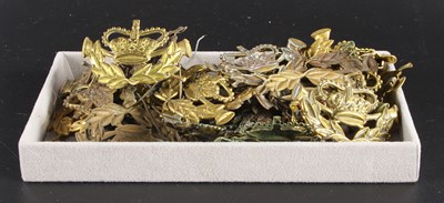 Lot 553 - A collection of brass Royal Mail postman's cap...