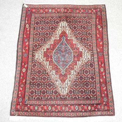 Lot 360 - A Persian rug, with a central medallion