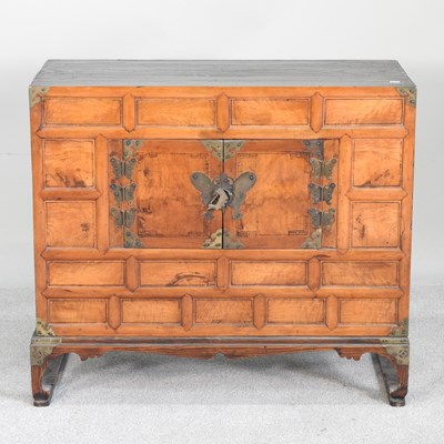 Lot 85 - A Korean fruitwood side cabinet on stand, 20th...