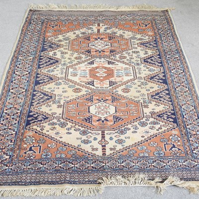 Lot 581 - A Turkish woollen rug, with three central...