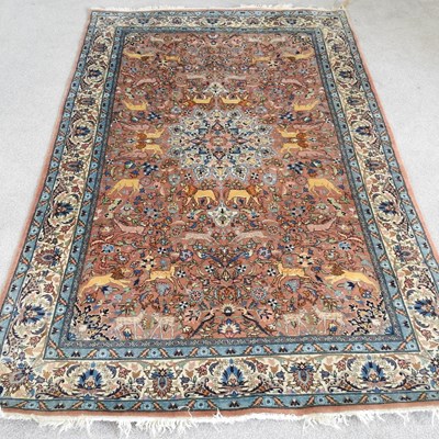 Lot 550 - An Indian carpet, decorated with animals and...
