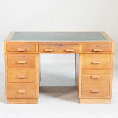 Lot 246 - A mid 20th century light oak pedestal desk,...