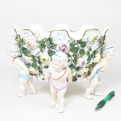 Lot 43 - A German porcelain figural basket, encrusted...