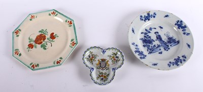 Lot 433 - An 18th century Delft plate, decorated with...