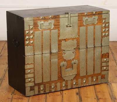 Lot 560 - A Korean elm cabinet, with elaborately etched...