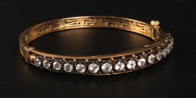 Lot 292 - A yellow metal paste set bangle