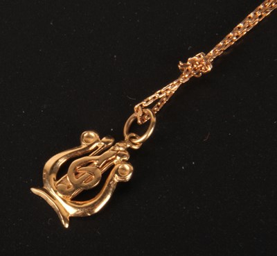 Lot 113 - A yellow metal pendant and chain, the pendant...