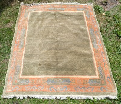 Lot 348 - A 1980s Nepalese Kangri rug, on a green ground