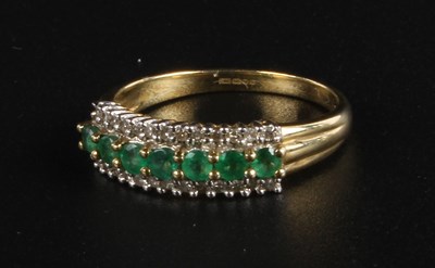 Lot 123 - A 9 carat yellow gold emerald and diamond...