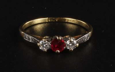Lot 81 - An 18 carat yellow gold ruby and diamond three...