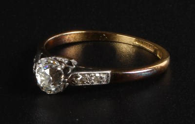 Lot 99 - An 18 carat yellow gold diamond solitaire ring,...
