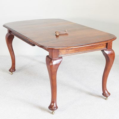 Lot 513 - A 1920s wind-out extending dining table, with...