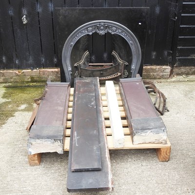 Lot 542 - A cast iron fire insert, 97cm wide, with a...