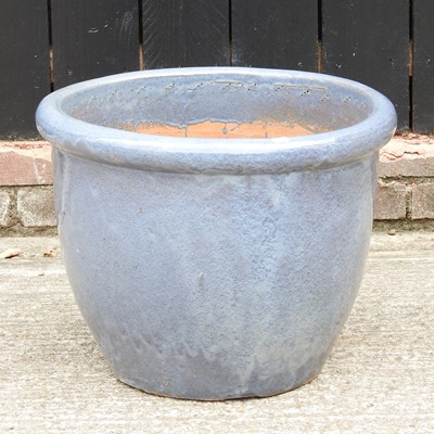 Lot 451 - A large blue glazed garden pot, 41cm high