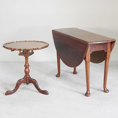 Lot 480 - A reproduction yew wood tripod table, 59cm...
