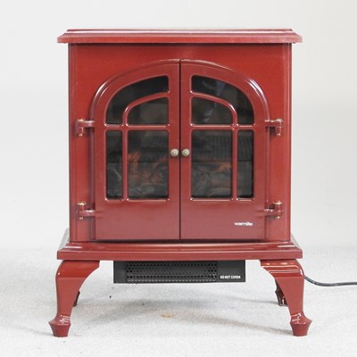 Lot 651 - An electric heater, in the form of a stove