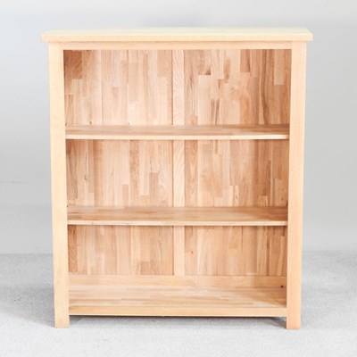 Lot 401 - A modern light oak dwarf open bookcase