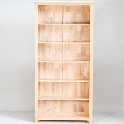 Lot 220 - A modern light oak standing open bookcase