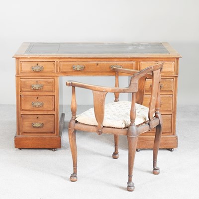 Lot 424 - An Edwardian walnut pedestal desk, with an...