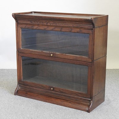 Lot 569 - An early 20th century oak Globe Wernicke style bookcase