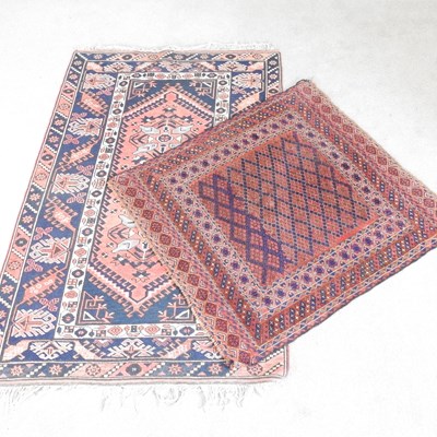 Lot 481 - A Turkish rug, with geometric designs, on a...