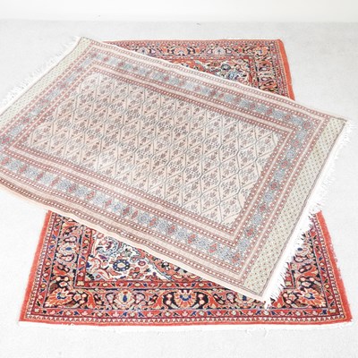 Lot 593 - A Persian carpet on a red ground, 206 x 141cm ,...