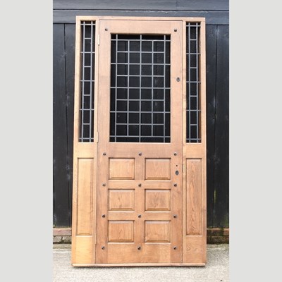 Lot 329 - A large bespoke made oak panelled exterior doorway