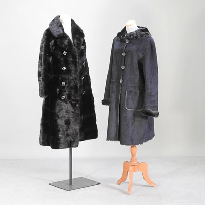 Lot 69 - An Armani black faux sheepskin coat, together...
