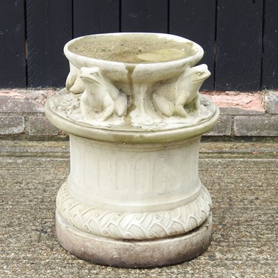 Lot 195 - A cast stone garden bird bath, decorated with...