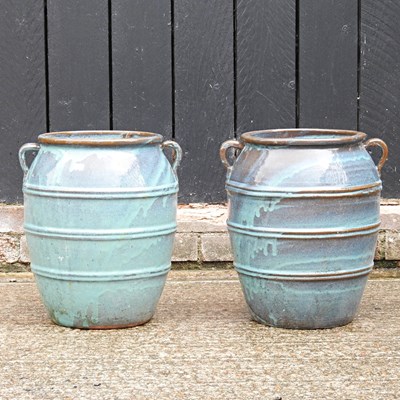 Lot 423 - A pair of blue glazed garden pots, 39cm high (2)
