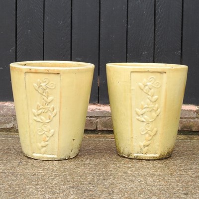 Lot 460 - A pair of yellow glazed garden pots, 44cm high...