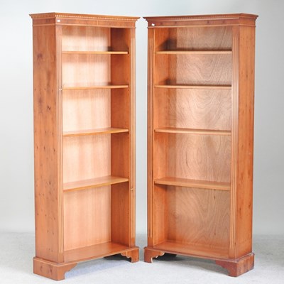 Lot 323 - A pair of reproduction yew wood open standing...