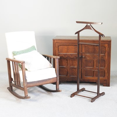 Lot 647 - A 1920s oak rocking chair, together with a...
