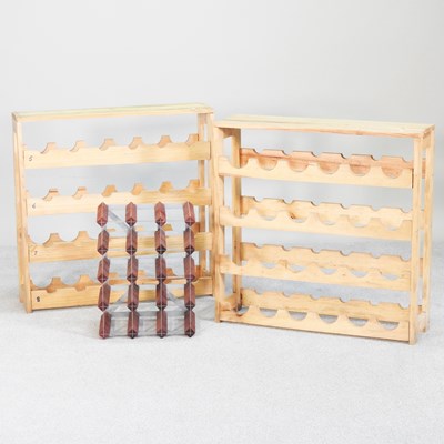 Lot 422 - A pair of wooden wine racks, each 71cm wide,...