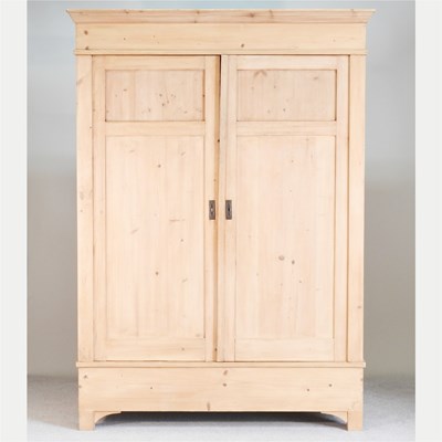 Lot 64 - An antique continental pine armoire, enclosed...