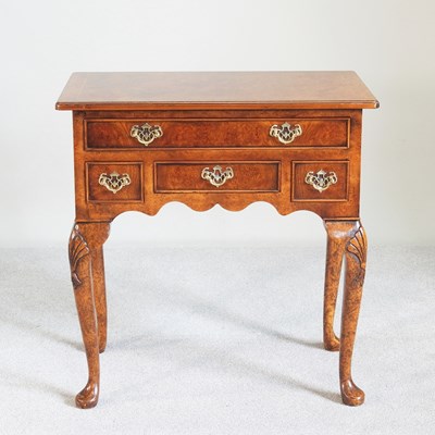 Lot 612 - A good quality burr walnut lowboy, of 18th...