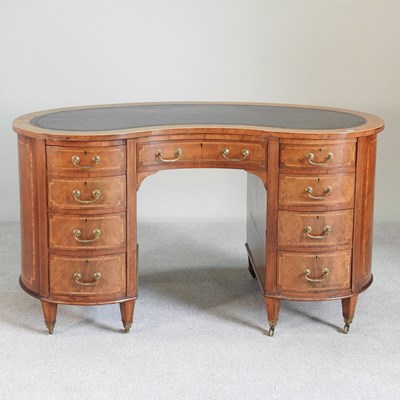 Lot 590 - An Edwardian inlaid kidney shaped desk, with...