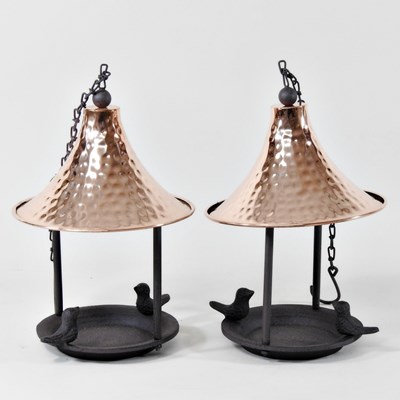 Lot 187 - A pair of metal garden bird feeders, each with...